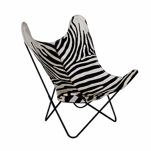 Photo de FAUTEUIL AA AIRBORNRE EN PEAU DE VACHE ZÉBRÉE